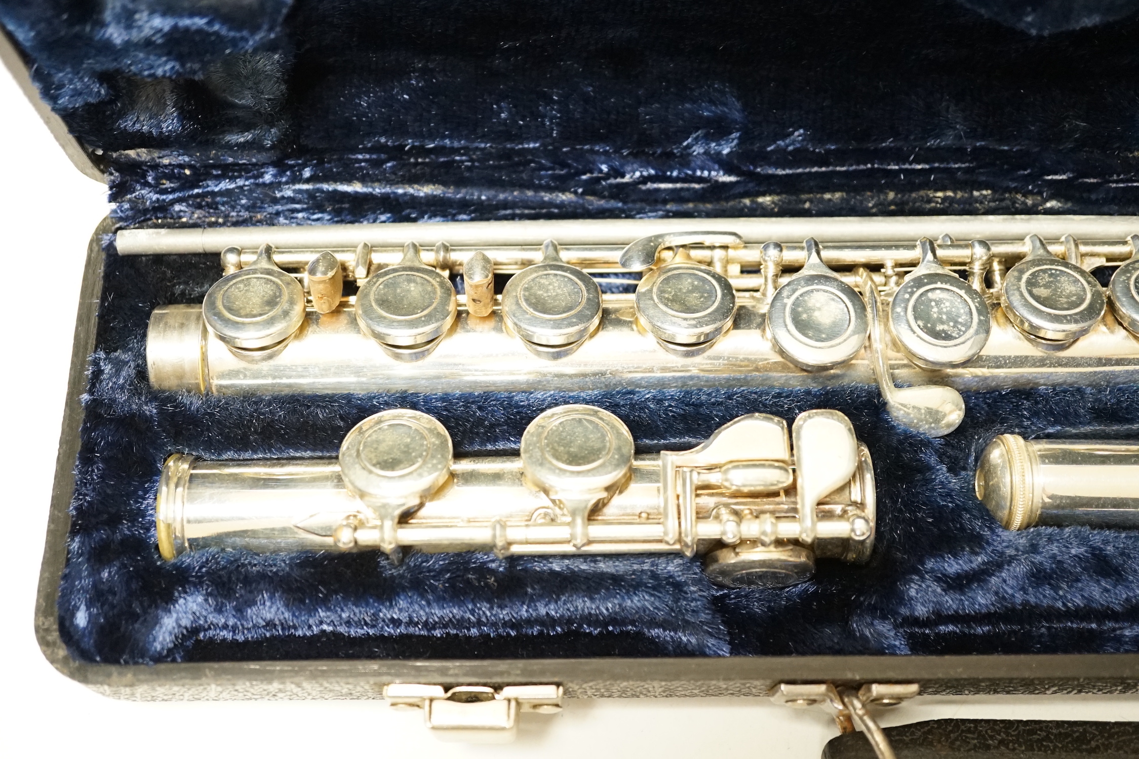 A cased Boosey and Hawkes 400 flute with closed hole key work